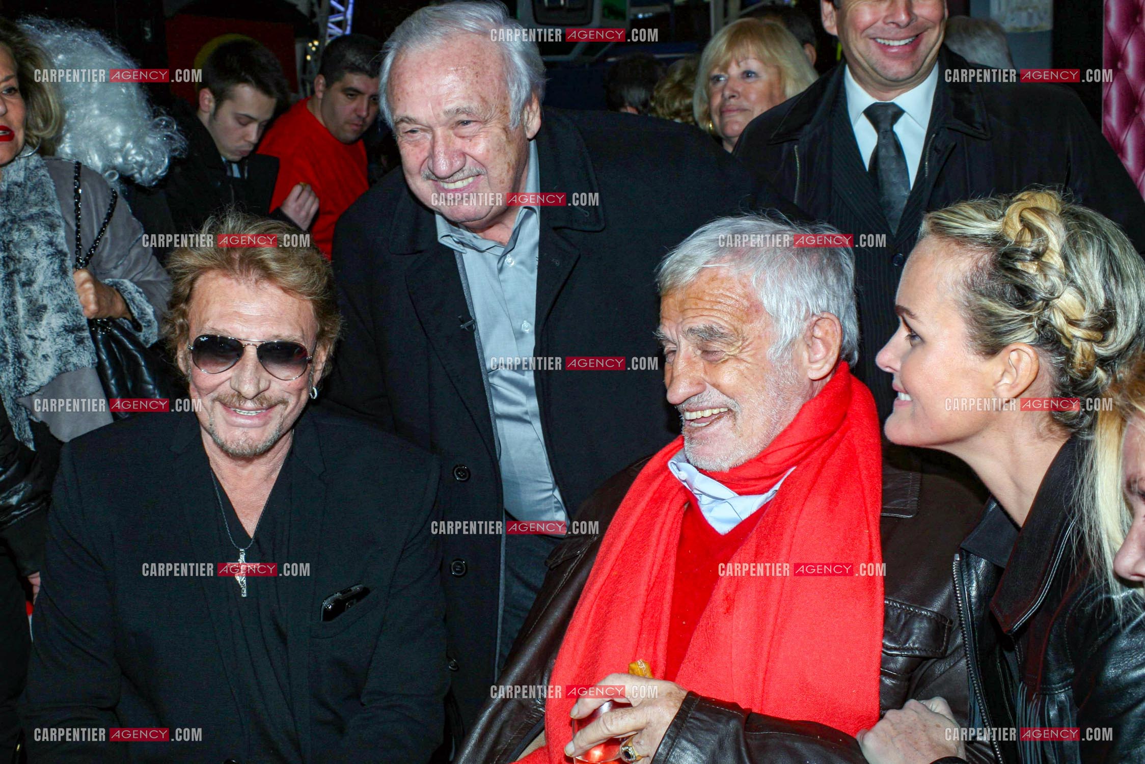 Le chanteur Johnny Hallyday, Marcel Campion, Jean-Paul Belmondo et Laeticia à Paris en 2013.