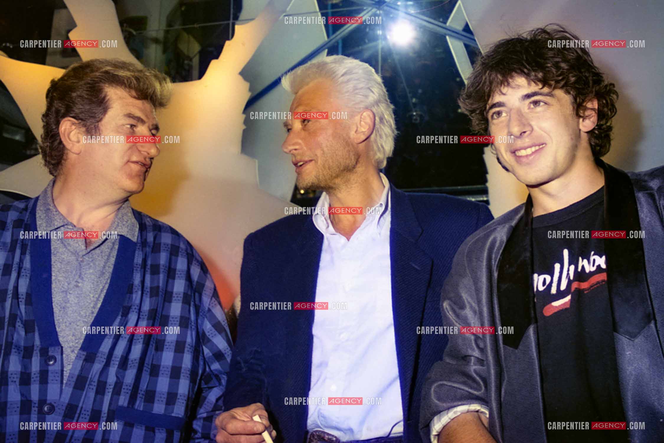 Les chanteurs Eddy Mitchell, Johnny Hallyday et Patrick Bruel au centre Beaugrenelle pour l'inauguration de La Boutique des Stars.