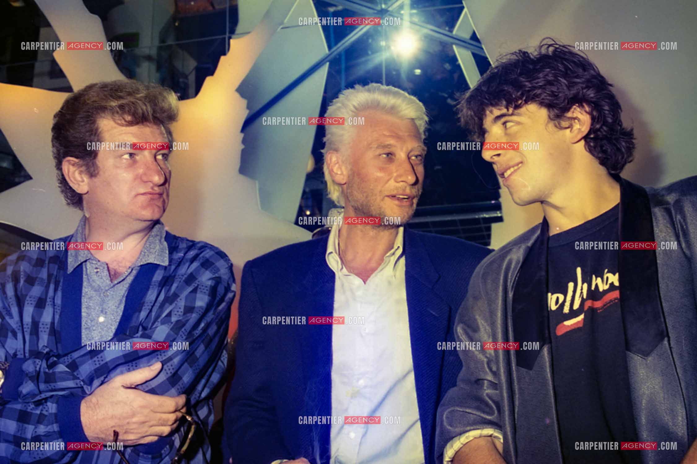 Les chanteurs Eddy Mitchell, Johnny Hallyday et Patrick Bruel au centre Beaugrenelle pour l'inauguration de La Boutique des Stars.