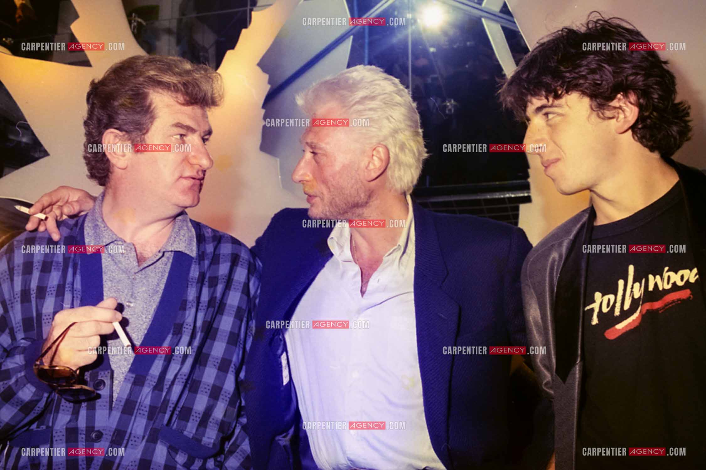 Les chanteurs Eddy Mitchell, Johnny Hallyday et Patrick Bruel au centre Beaugrenelle pour l'inauguration de La Boutique des Stars.