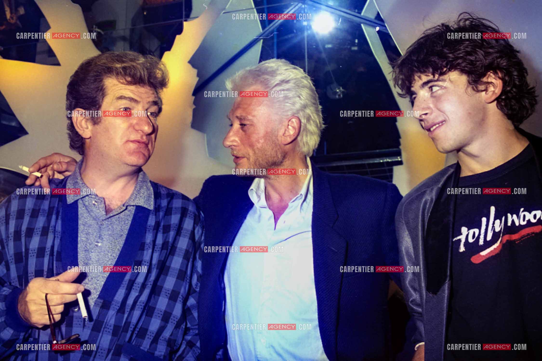 Les chanteurs Eddy Mitchell, Johnny Hallyday et Patrick Bruel au centre Beaugrenelle pour l'inauguration de La Boutique des Stars.