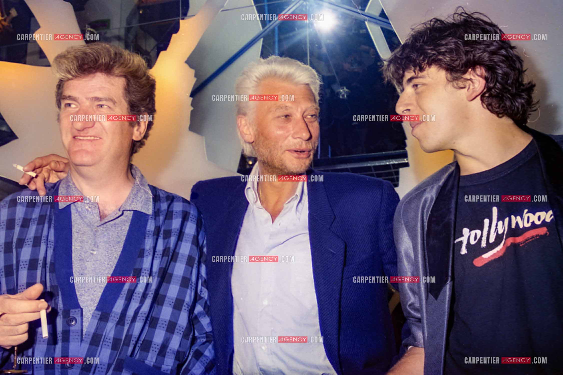 Les chanteurs Eddy Mitchell, Johnny Hallyday et Patrick Bruel au centre Beaugrenelle pour l'inauguration de La Boutique des Stars.