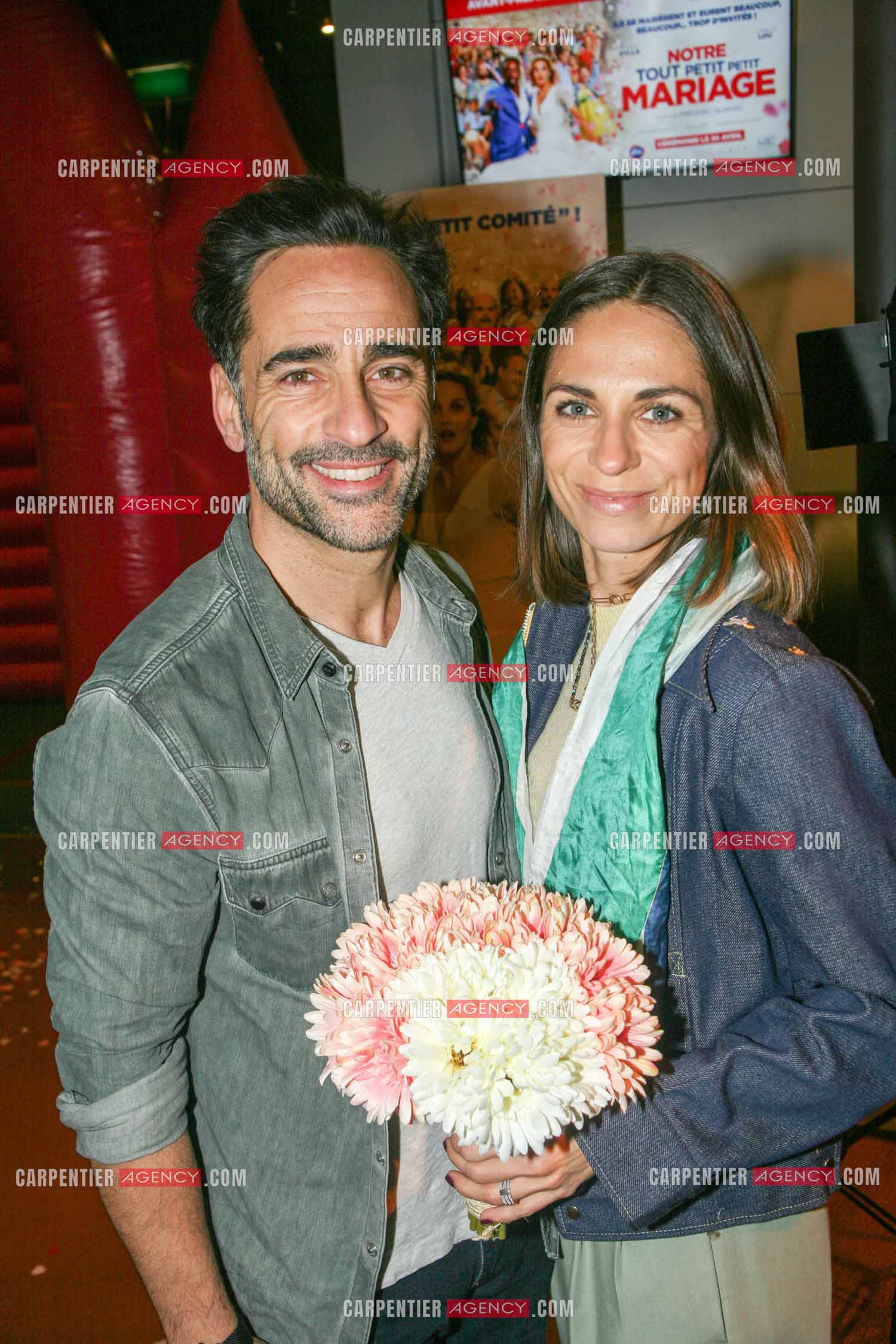 Première du film “ Notre tout petit mariage “ a l'UGC Paris. Florent Peyre et sa femme Virginie.